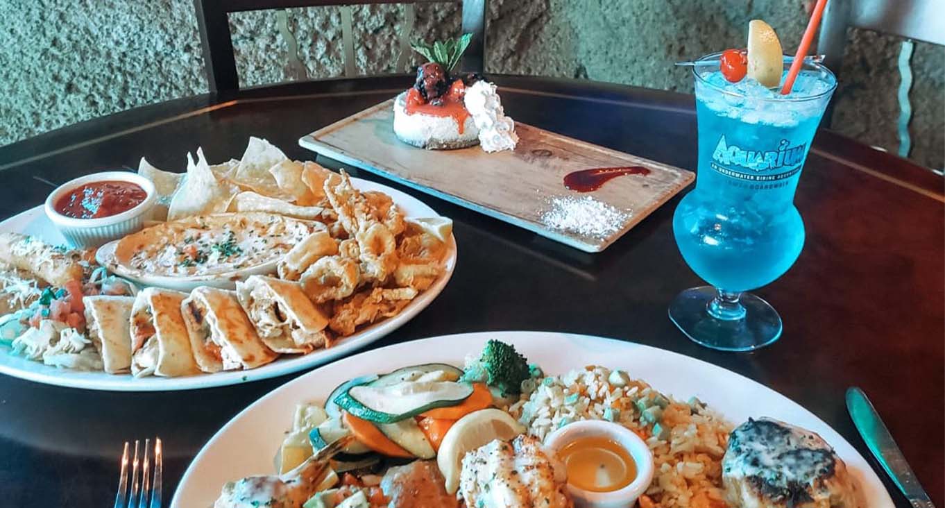 Seafood platters with a dessert and cocktail.